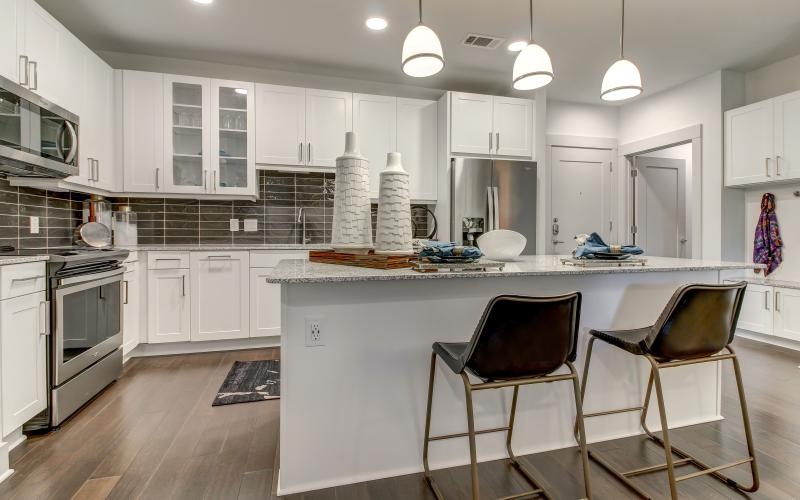 a kitchen with white cabinets