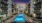 a pool in a courtyard between buildings