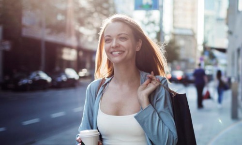 a woman holding a coffee cup